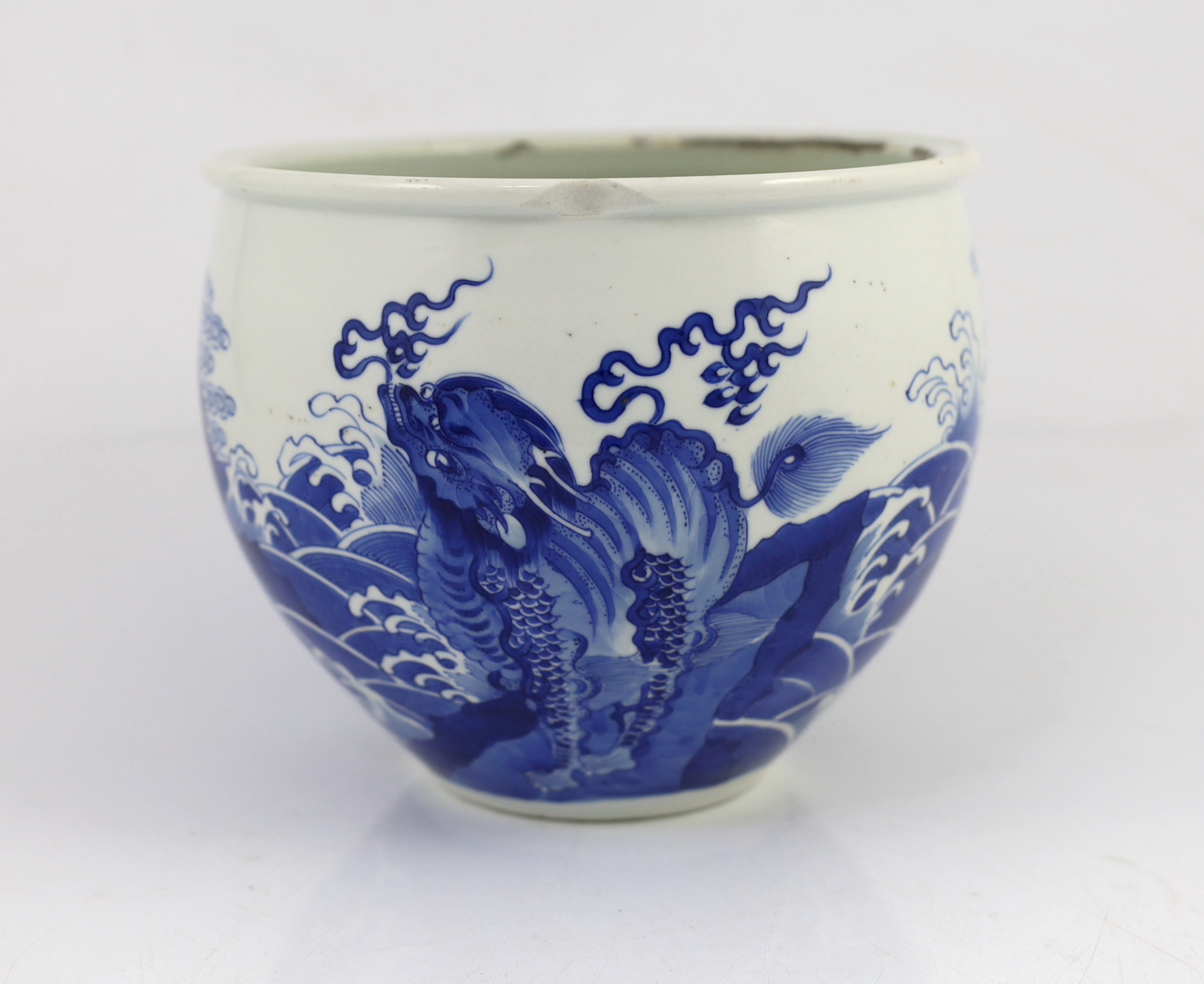 A Chinese blue and white ‘mythical beasts’ jardiniere, Kangxi period, chip and glaze losses to rim